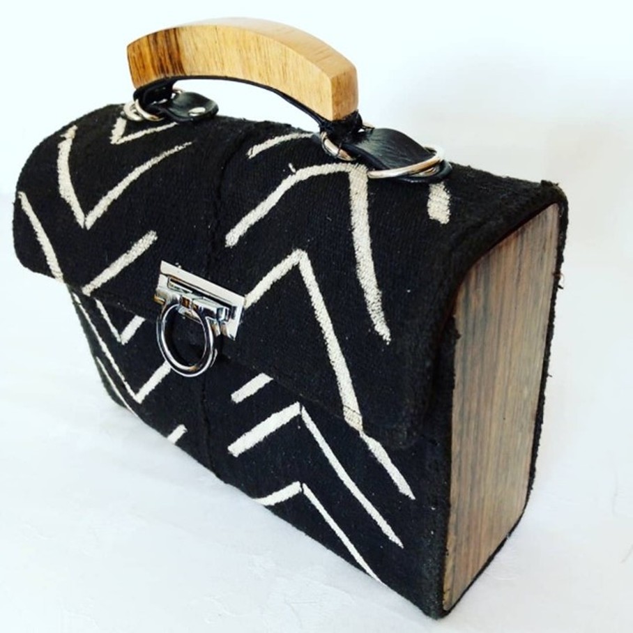 Text: Bags in black and white and yellow and black with wood finish.