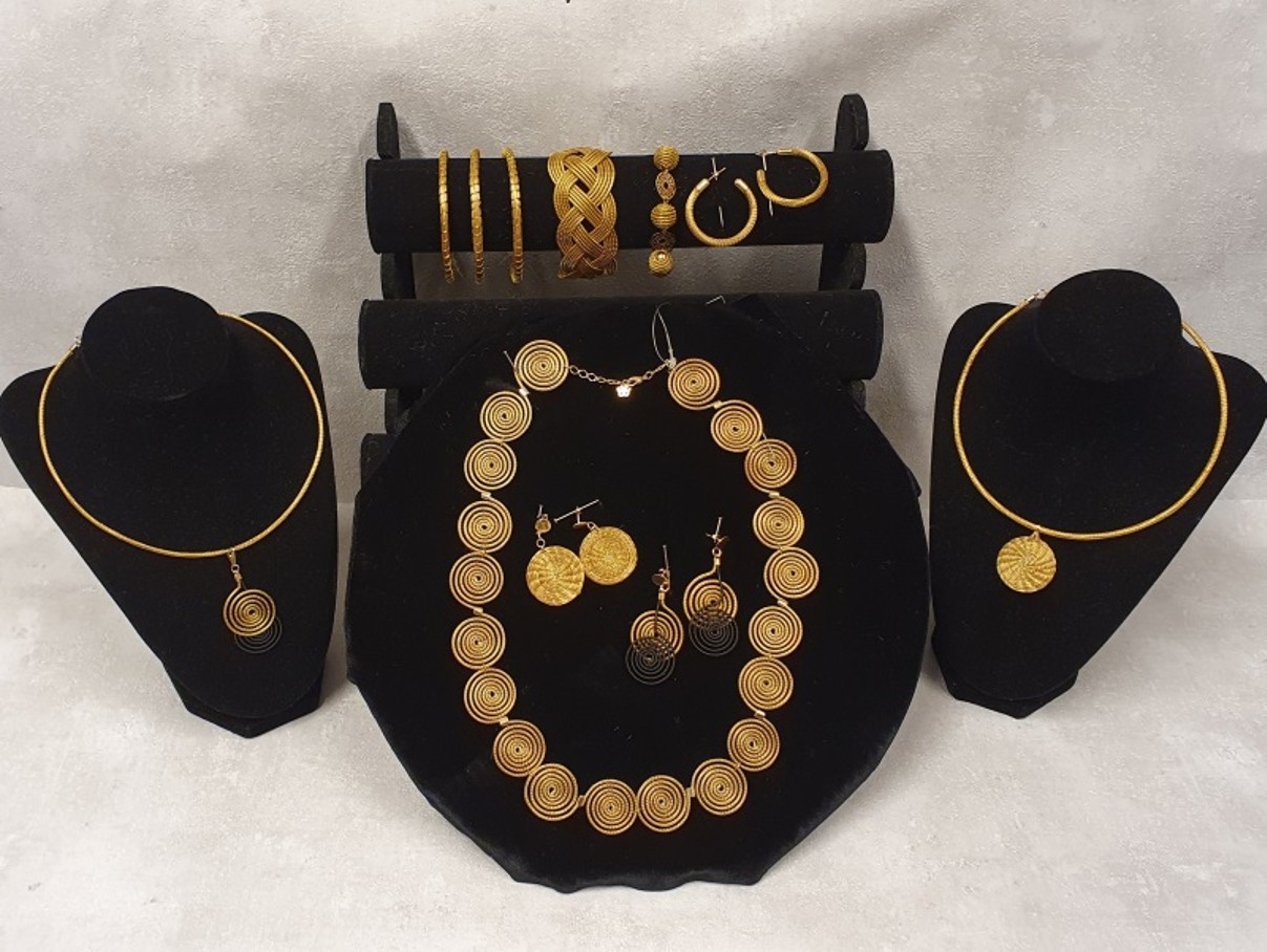 Gold jewellery on display in various forms. 